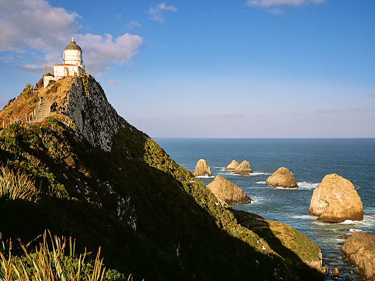 The lighthouse at the Nuggets which is south of Duneden on New Zealand's South Island.
